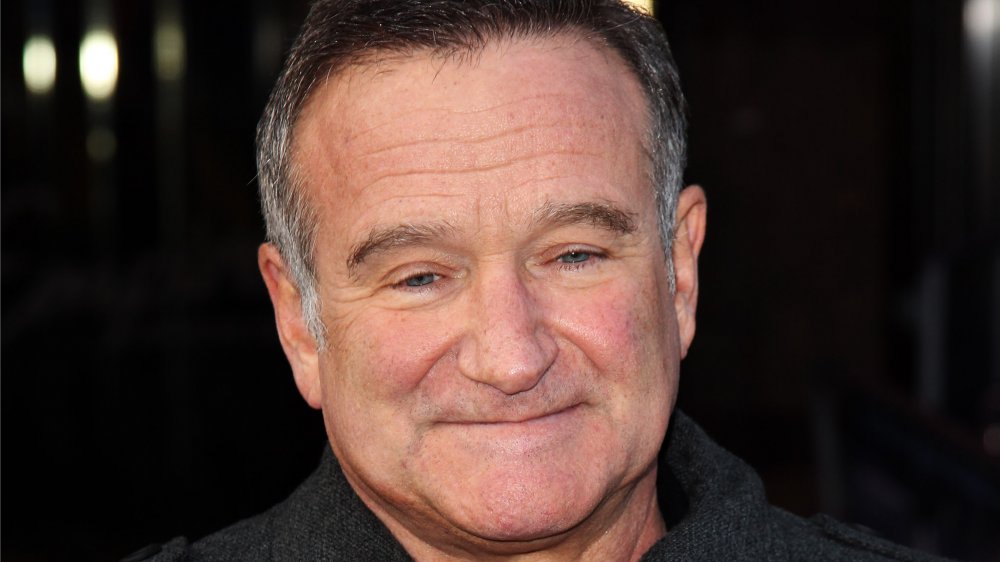 Robin Williams with a small smile