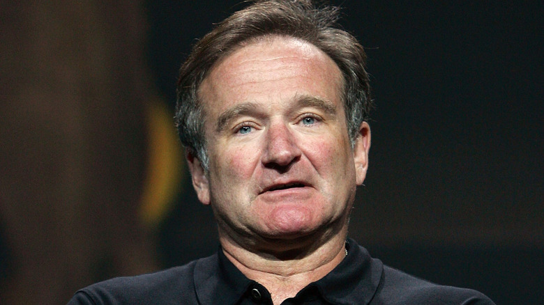 Robin Williams looking straight ahead with a blank expression