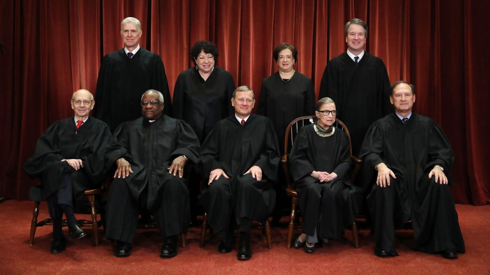 The Supreme Court, seated and smiling