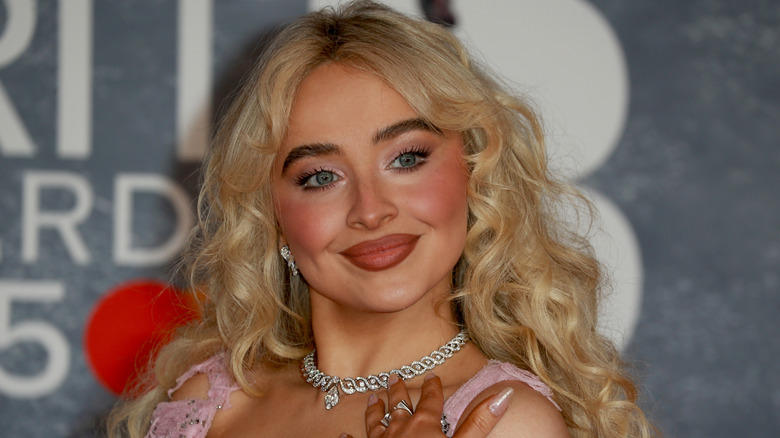 Sabrina Carpenter smiling at the 2025 BRIT Awards
