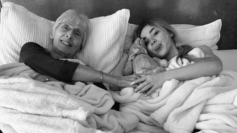 Sabrina Carpenter laying in bed with her grandmother Marilyn Cartwright in bed