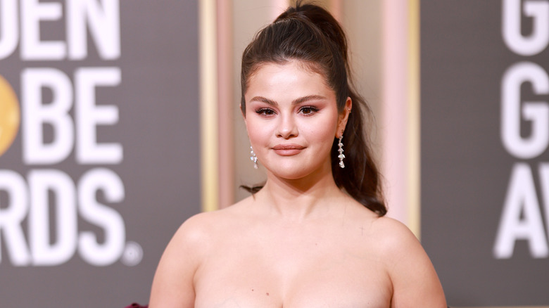Selena Gomez smirking