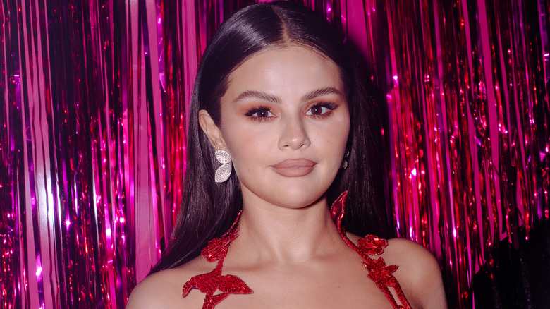 Selena Gomez smirking