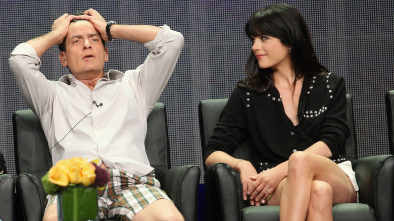 Selma Blair looking at exasperated Charlie Sheen
