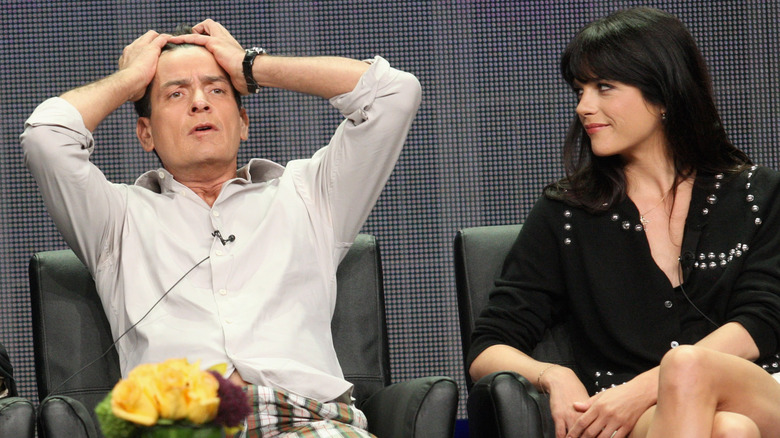 Selma Blair looking at exasperated Charlie Sheen