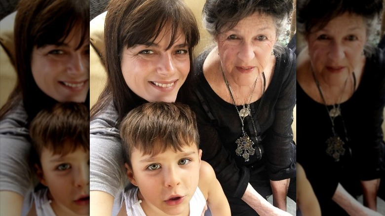 Selma Blair smiling with mom and son