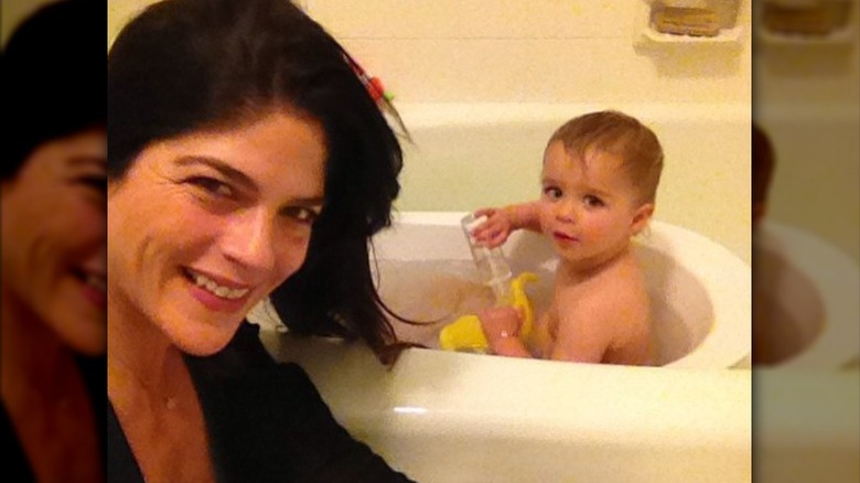 Selma Blair giving her son a bath
