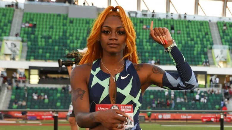 Sha'Carri Richardson raises fist