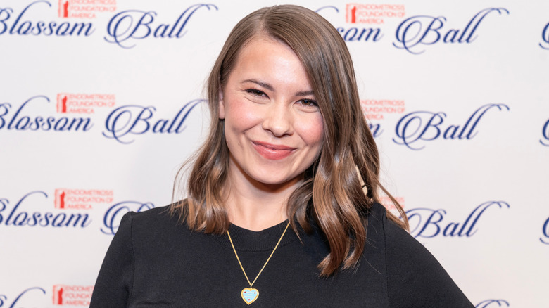 Bindi Irwin wearing a black dress