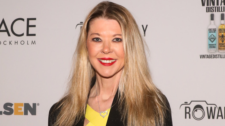 Tara Reid posing at an event