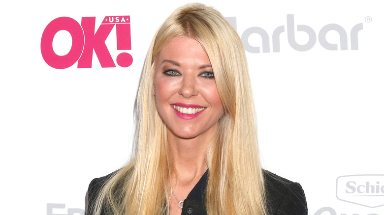 Tara Reid posing at an event