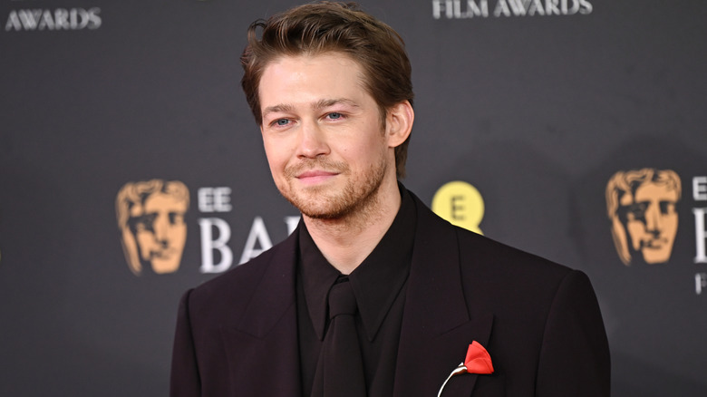 Joe Alwyn posing at the BAFTAs