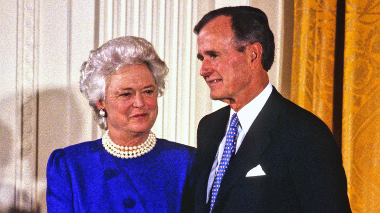 Barbara and George H.W. Bush smiling at a National Medal of Arts ceremony
