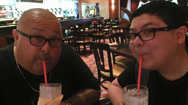 Roy and Rico Rodriguez sharing a milkshake