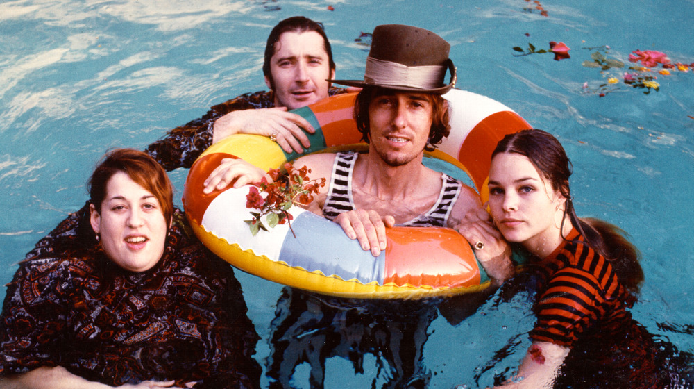 The Mamas and the Papas in a pool