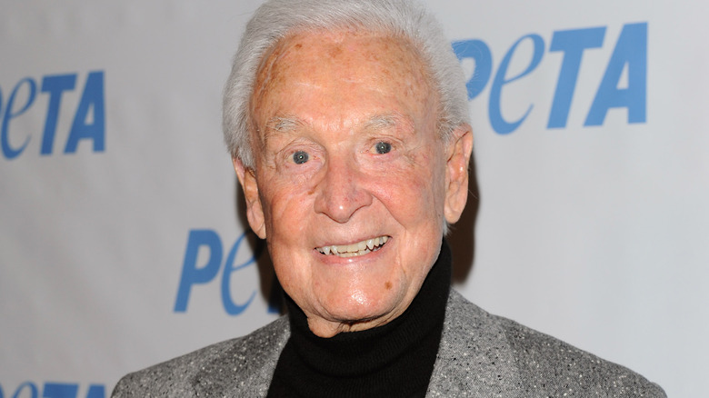 Bob Barker all smiles in a black turtle-neck 