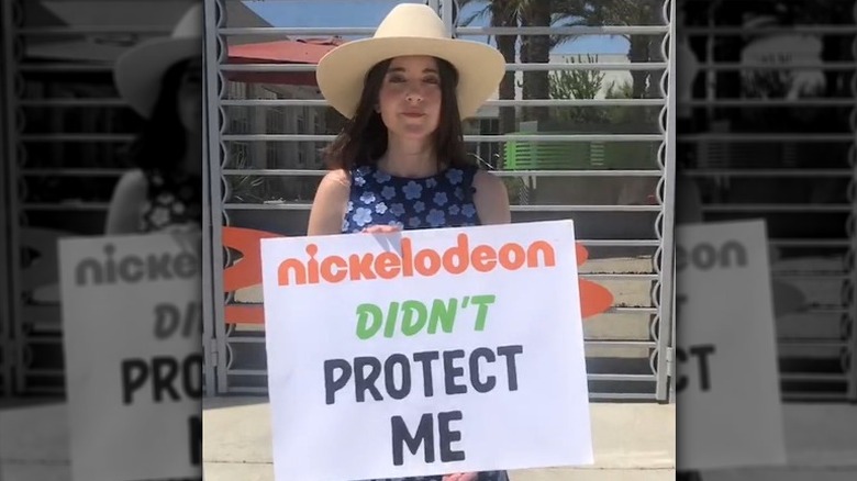 Alexa Nikolas holding sign