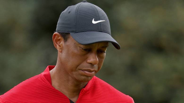 Tiger Woods looking down