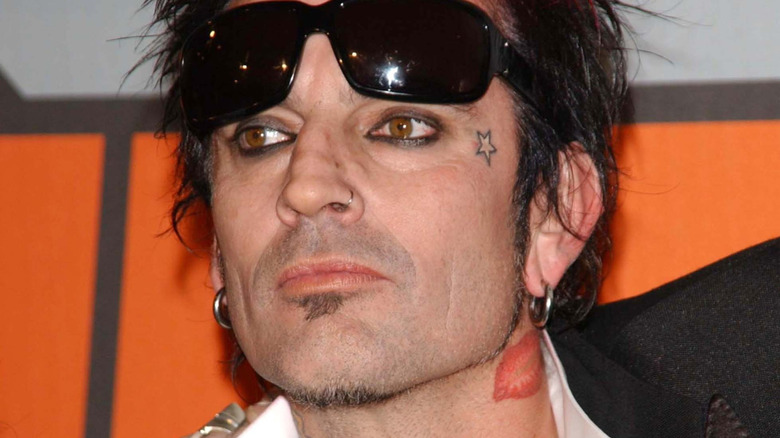 Tommy Lee with sunglasses pushed up