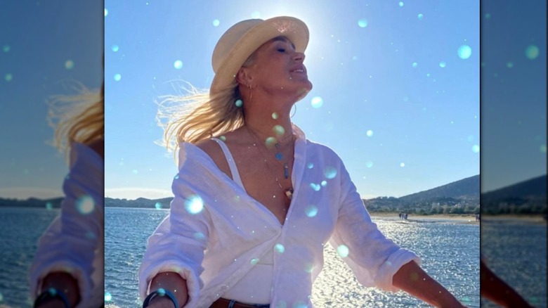 Yolanda Hadid posing by the water