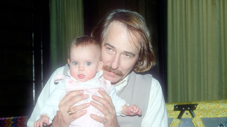 John Phillips holding baby Bijou Phillips
