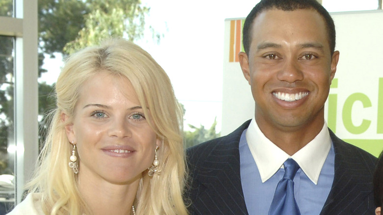 Elin Nordegren and Tiger Woods smile for a photo