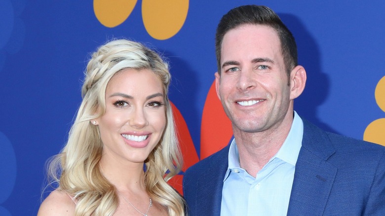 Tarek El Moussa and Heather Rae El Moussa smiling