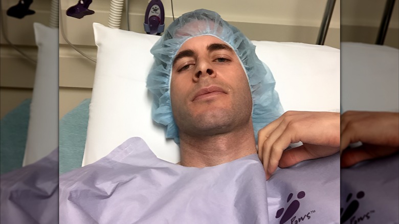 Tarek El Moussa in a hospital bed