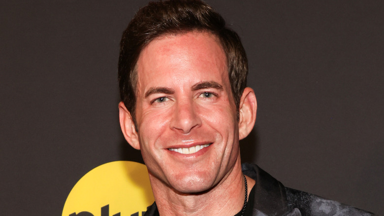 Tarek El Moussa smiling on 2024 red carpet