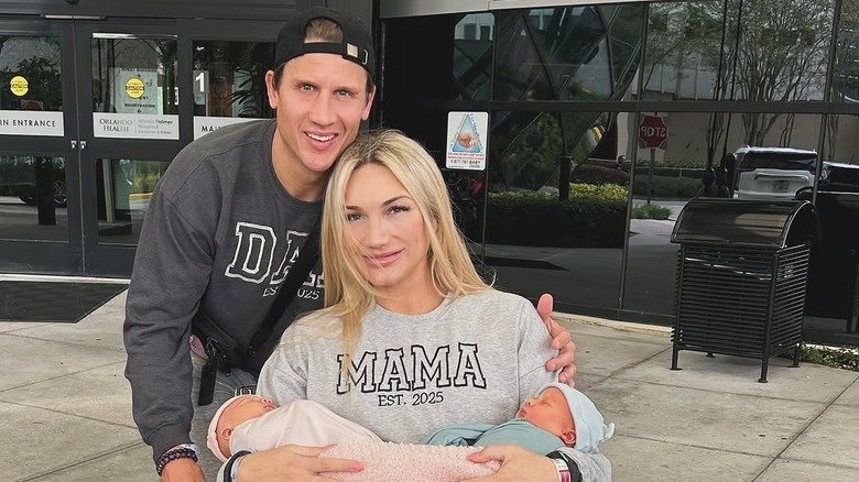 Brooke Hogan poses with Steven Oleksy and their newborn twins