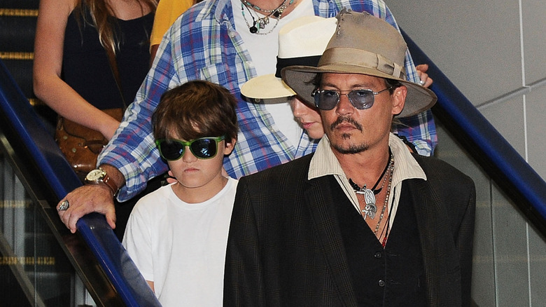 Jack and Johnny Depp coming down an escalator together.