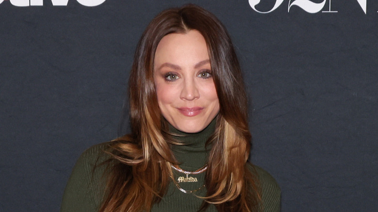 Kaley Cuoco poses on a red carpet