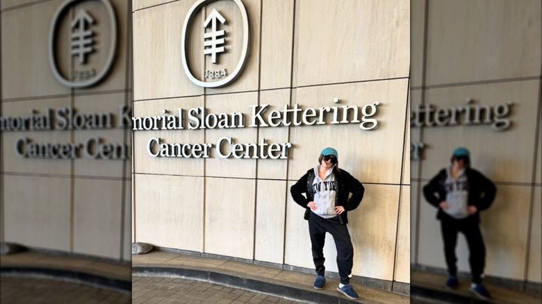 Kat Timpf poses outside her cancer treatment center.