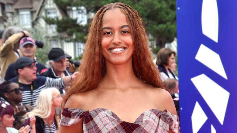 Malia Obama smiles on a 2024 red carpet