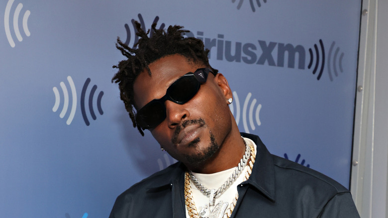 Antonio Brown on red carpet wearing shades