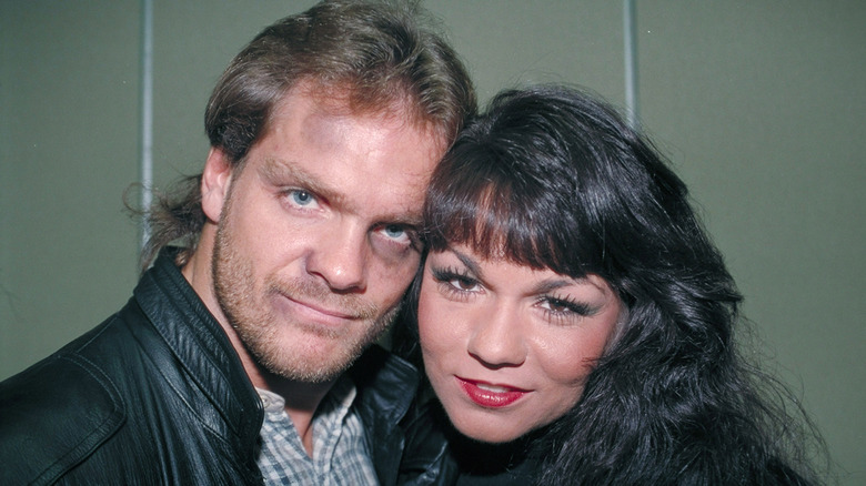 Chris Benoit posing with his wife