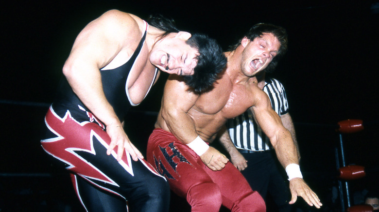 Chris Benoit smacks Eddie Guerrero during a match in 1995