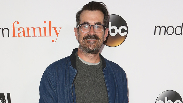 Ty Burrell wearing blue denim smart jacket on red carpet