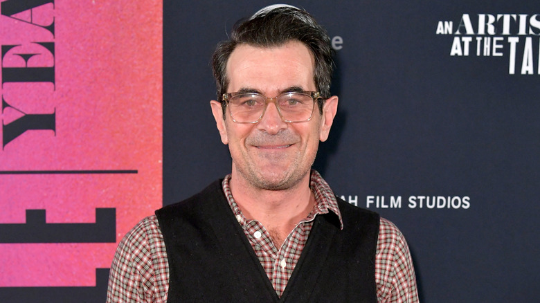 Ty Burrell wearing black vest on red carpet