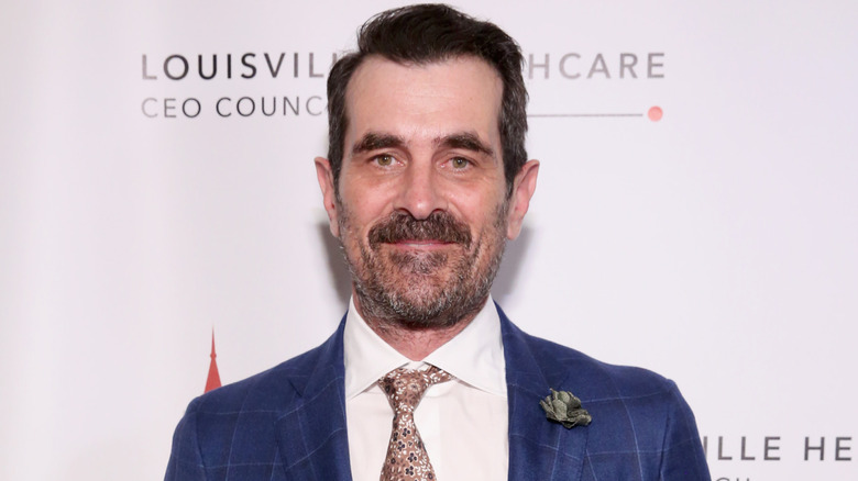 Ty Burrell wearing blue plaid suit on red carpet