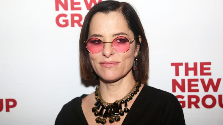 Parker Posey in sunglasses.
