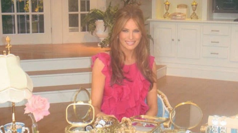 Melania Trump posing for photo in QVC studio