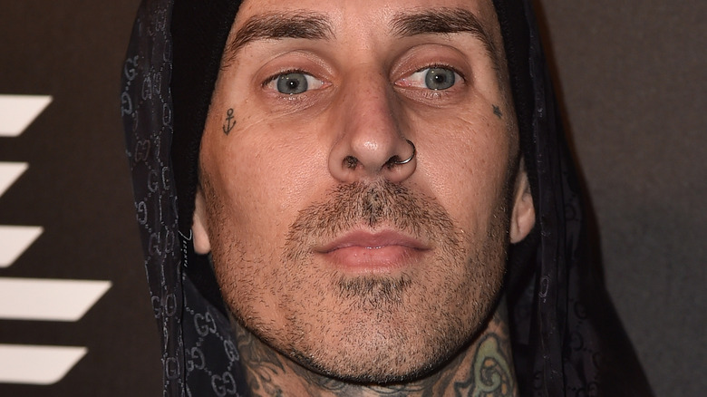 Travis Barker looking away