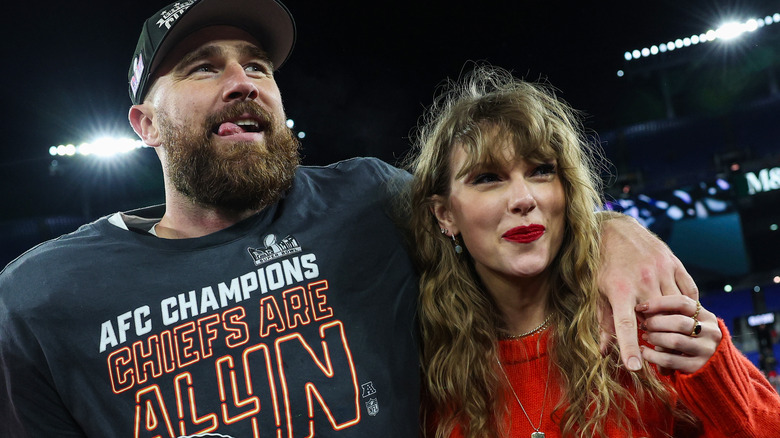 Taylor Swift and Travis Kelce embracing