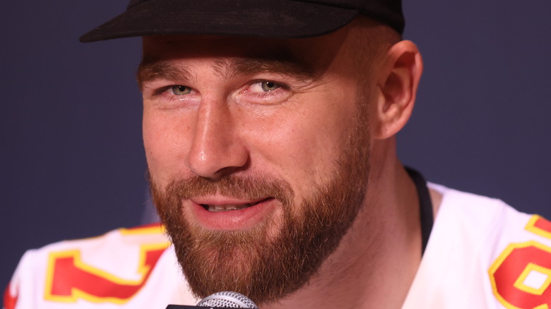 Travis Kelce speaking at a press conference