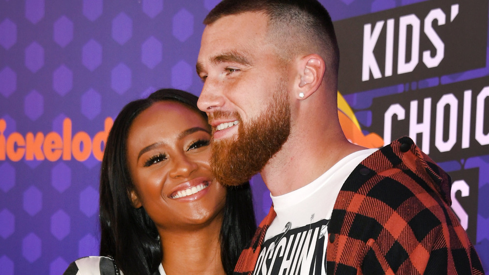 Kayla Nicole and Travis Kelce pose for photos