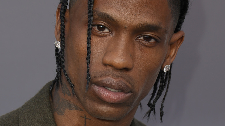 Travis Scott dreadlocks diamond earrings