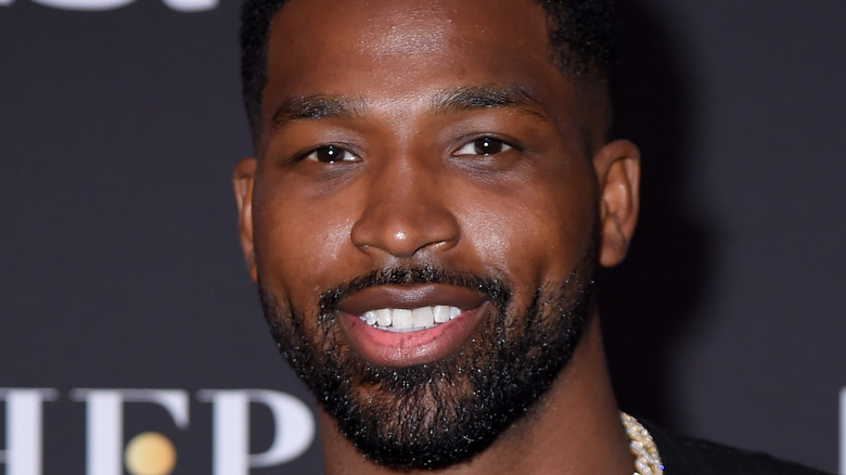 Tristan Thompson smiles at an event