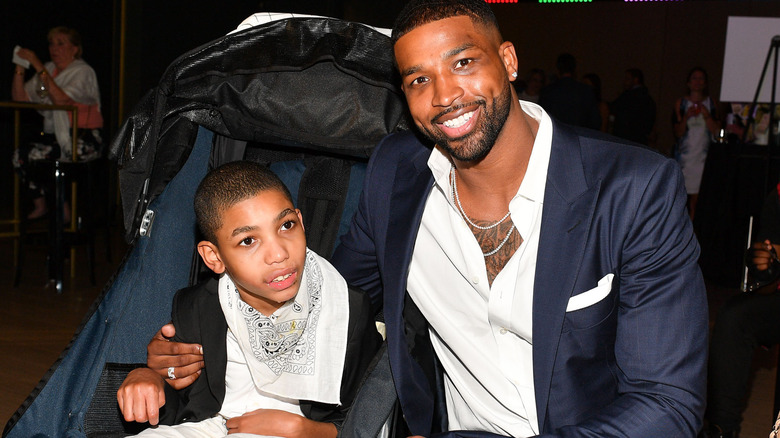 Tristan Thompson sitting with his brother Amari