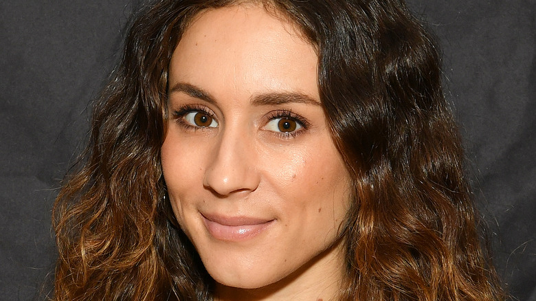 Troian Bellisario smiling